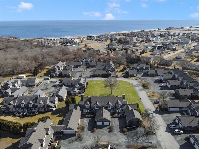 drone / aerial view with a residential view and a water view