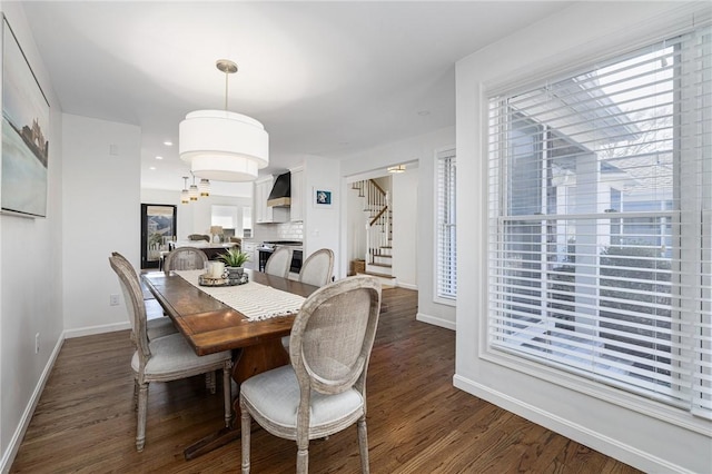 dining area featuring recessed lighting, dark wood finished floors, baseboards, and stairs