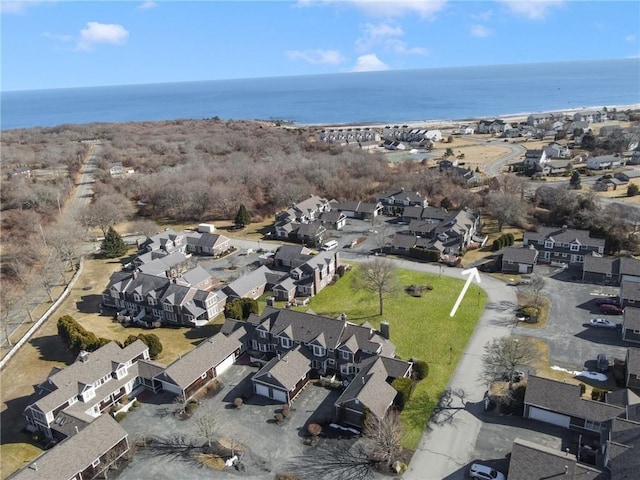 bird's eye view featuring a water view and a residential view