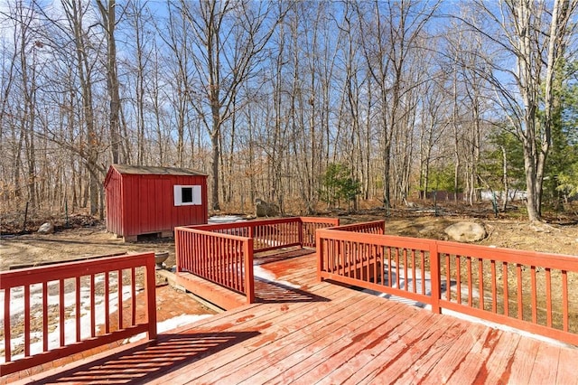 deck with a storage unit and an outdoor structure