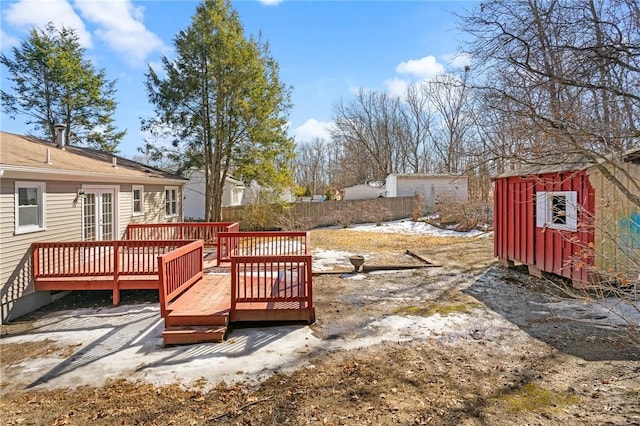 exterior space with ac unit, fence, and a deck