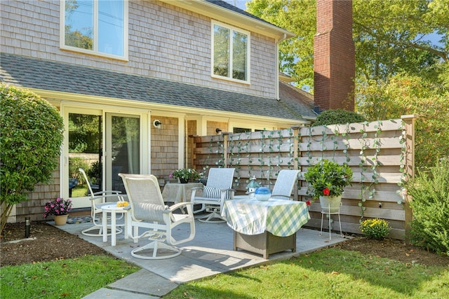 view of patio featuring fence