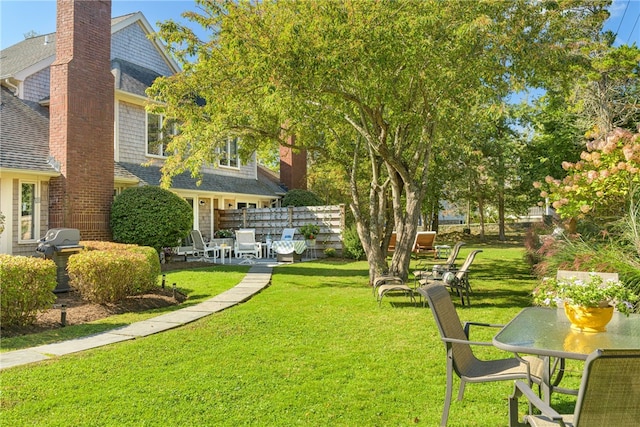 view of yard with a patio and fence