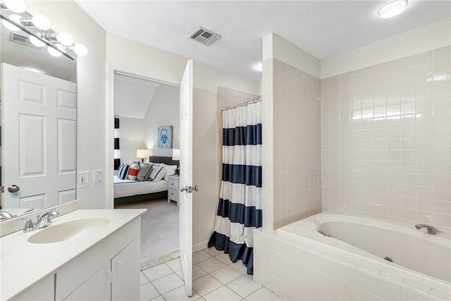 full bathroom with tile patterned floors, visible vents, connected bathroom, and vanity