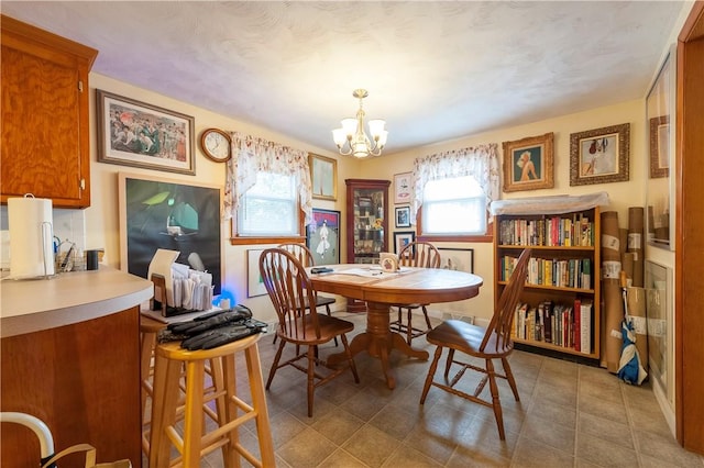 dining room with a notable chandelier