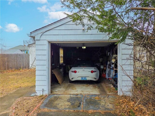 garage with fence