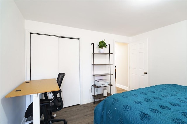 bedroom featuring a closet and wood finished floors