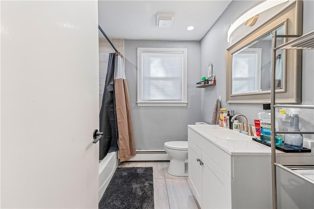 bathroom with baseboard heating, toilet, shower / bath combo with shower curtain, vanity, and tile patterned flooring