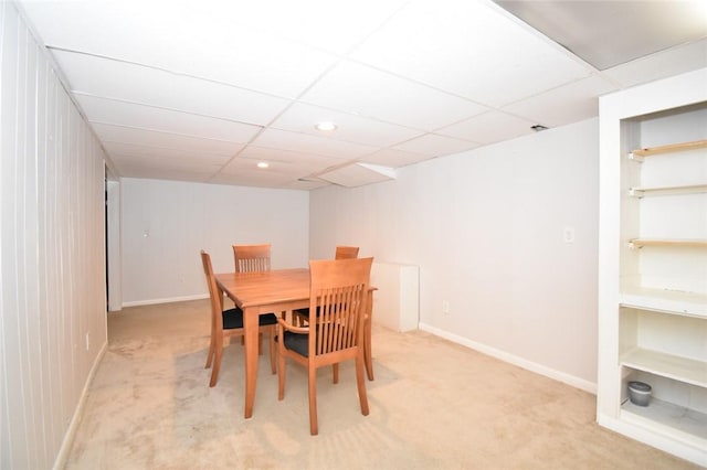 dining room with recessed lighting, light carpet, a drop ceiling, and baseboards