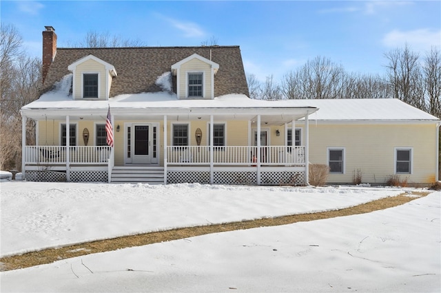 view of front of property featuring covered porch and a chimney