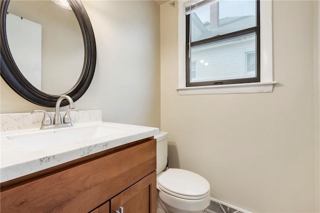 half bath with vanity and toilet