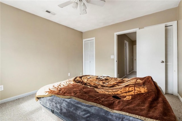 bedroom with a ceiling fan, carpet, visible vents, and baseboards