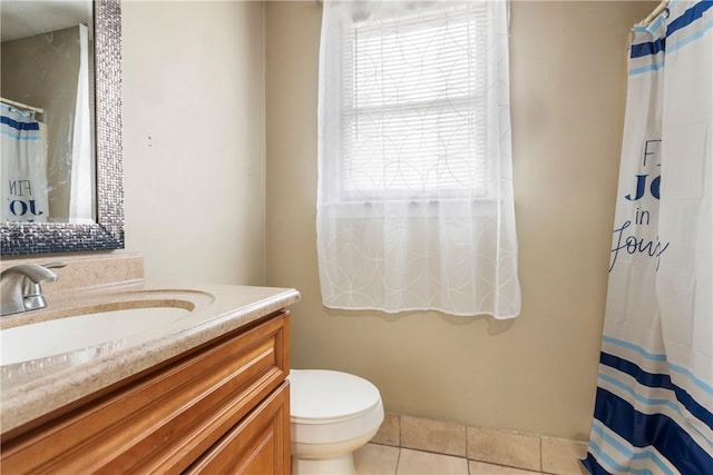 bathroom with tile patterned flooring, a shower with shower curtain, vanity, and toilet