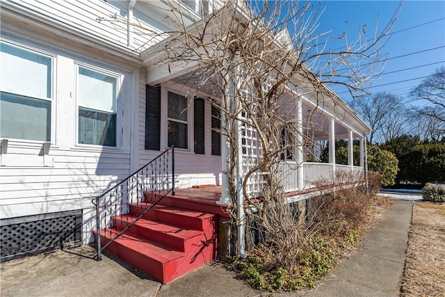 view of side of home with a sunroom