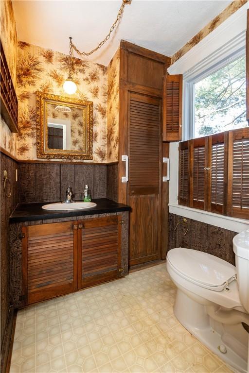 bathroom with vanity, toilet, and tile patterned floors