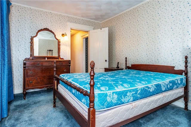 bedroom with carpet floors, crown molding, and wallpapered walls