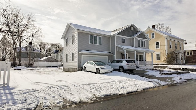 view of front of house featuring covered porch and an attached garage