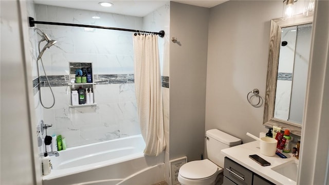 full bathroom featuring vanity, shower / bath combination with curtain, and toilet