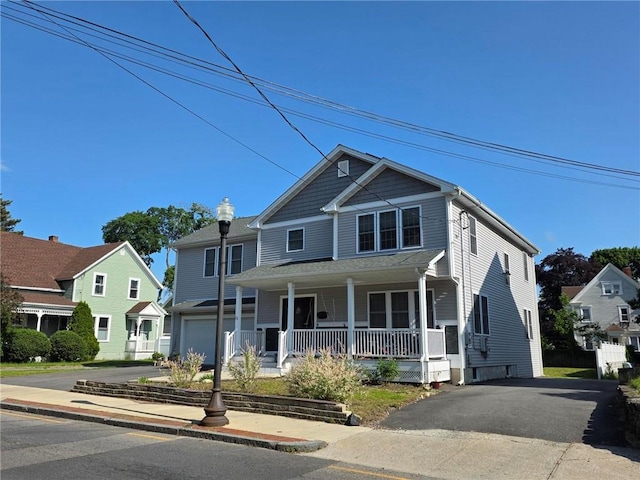 51 Spring St, Pawtucket, RI 02860 - view of front facade featuring covered porch, a garage, and driveway