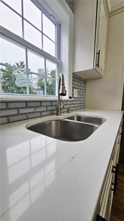 51 Spring St, Pawtucket, RI 02860 - kitchen featuring light stone counters and backsplash
