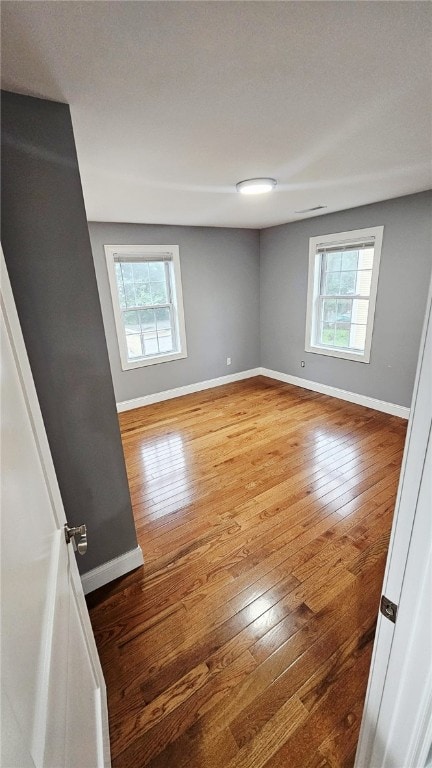 51 Spring St, Pawtucket, RI 02860 - spare room with plenty of natural light and hardwood / wood-style floors