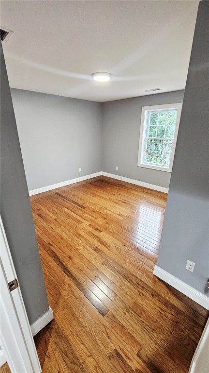 51 Spring St, Pawtucket, RI 02860 - spare room with hardwood / wood-style flooring and baseboards