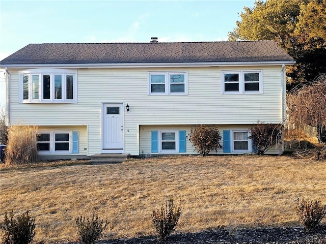 bi-level home featuring a front yard