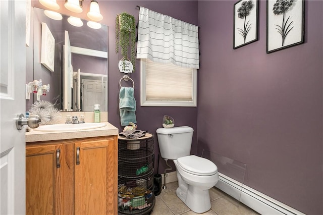 bathroom with a chandelier, tile patterned flooring, toilet, vanity, and baseboard heating