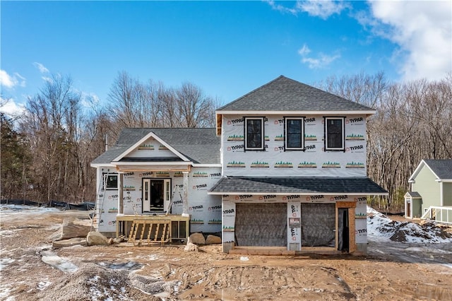 property in mid-construction with a garage, roof with shingles, and central AC unit