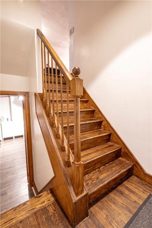 stairway with wood finished floors