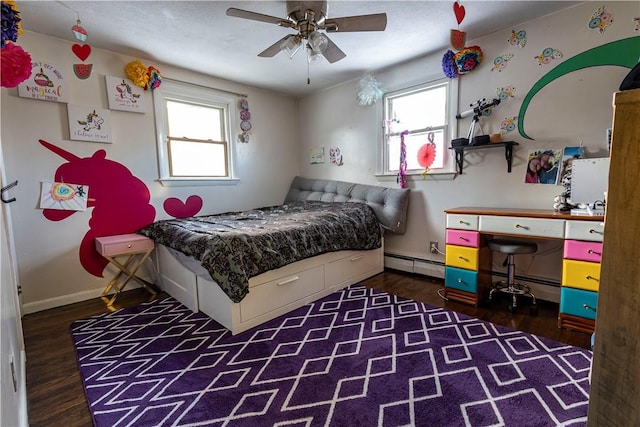 bedroom with ceiling fan, baseboards, baseboard heating, and wood finished floors