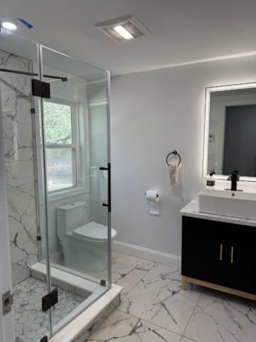 bathroom featuring a marble finish shower, baseboards, toilet, marble finish floor, and vanity