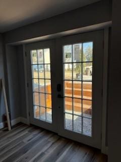 doorway to outside with wood finished floors