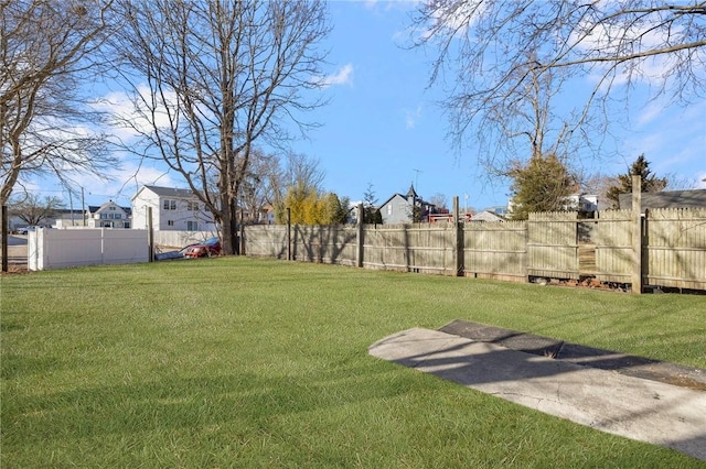 view of yard with a fenced backyard