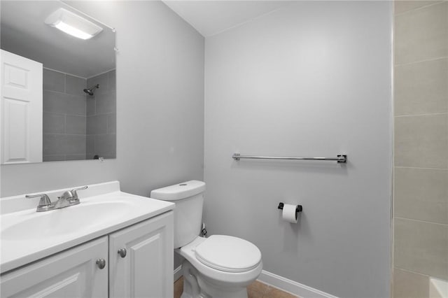 full bathroom with a shower, toilet, vanity, tile patterned flooring, and baseboards