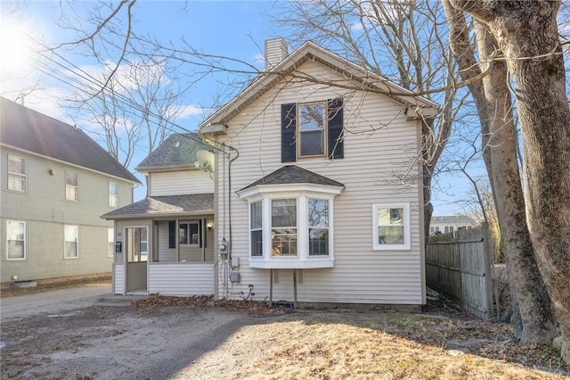 20 Cleveland St, South Kingstown, RI 02879 - traditional-style house with a shingled roof, a chimney, and fence