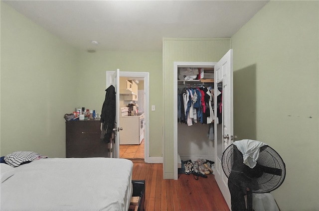 bedroom with hardwood / wood-style flooring and a closet