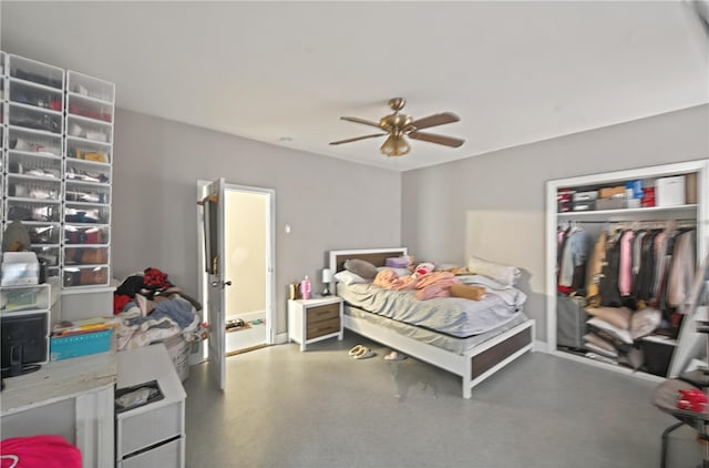 bedroom featuring a closet, ceiling fan, and finished concrete flooring