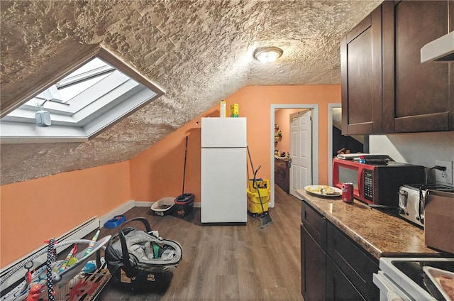 additional living space featuring light wood finished floors, baseboards, and lofted ceiling with skylight