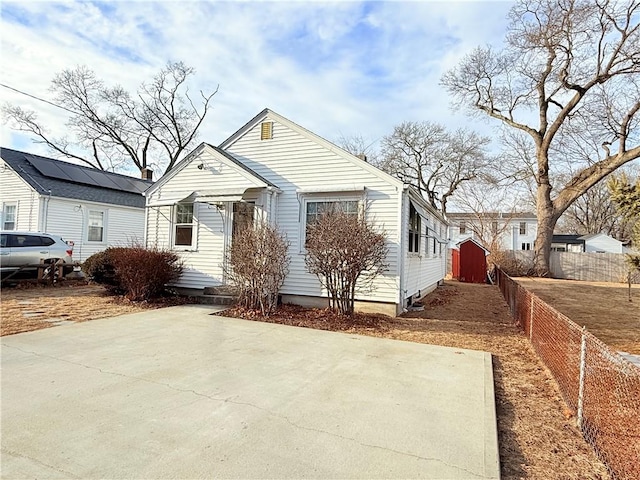 view of front of property featuring fence