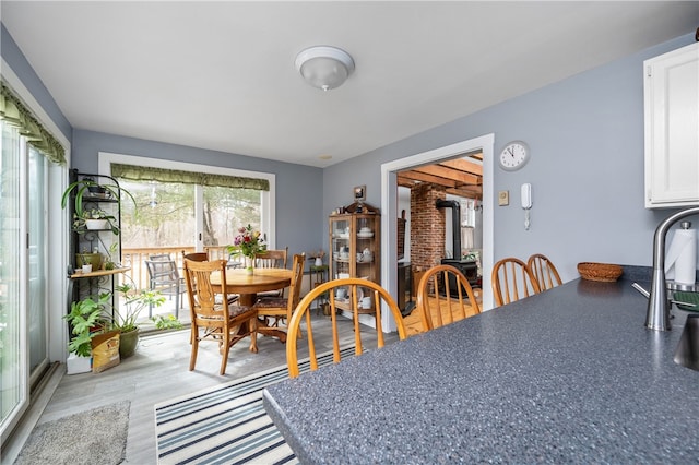 dining room featuring a wood stove