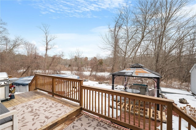 snow covered deck with a grill and a gazebo