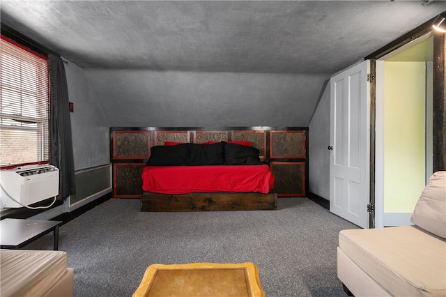 bedroom with vaulted ceiling, carpet floors, cooling unit, and baseboards