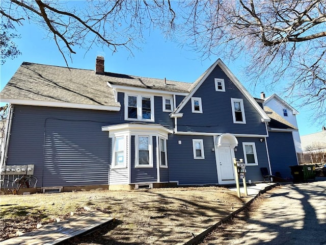 rear view of house with a chimney