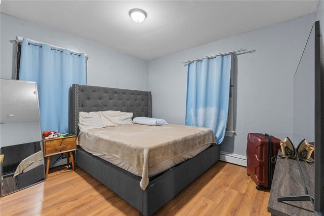 107 Lenox Ave, Providence, RI 02907 - bedroom with baseboard heating and wood finished floors
