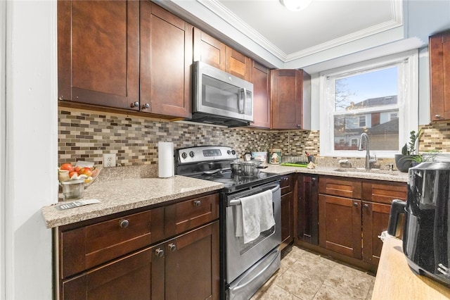 107 Lenox Ave, Providence, RI 02907 - kitchen featuring tasteful backsplash, light stone counters, ornamental molding, stainless steel appliances, and a sink