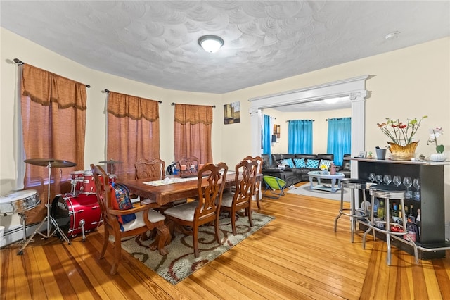107 Lenox Ave, Providence, RI 02907 - dining space featuring a textured ceiling and light wood finished floors