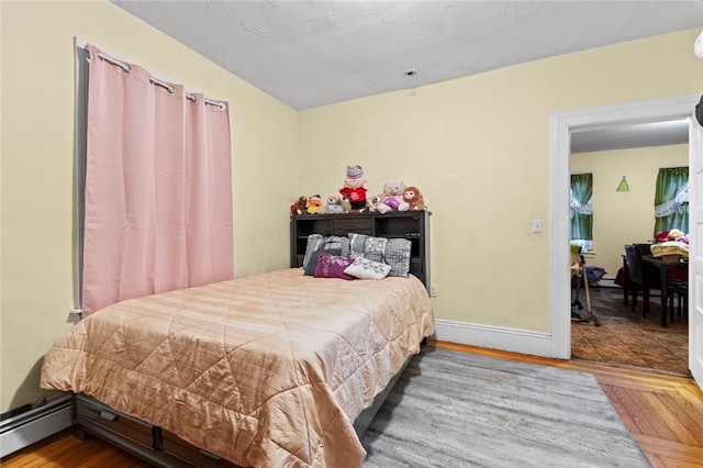107 Lenox Ave, Providence, RI 02907 - bedroom with a baseboard radiator, baseboards, and wood finished floors
