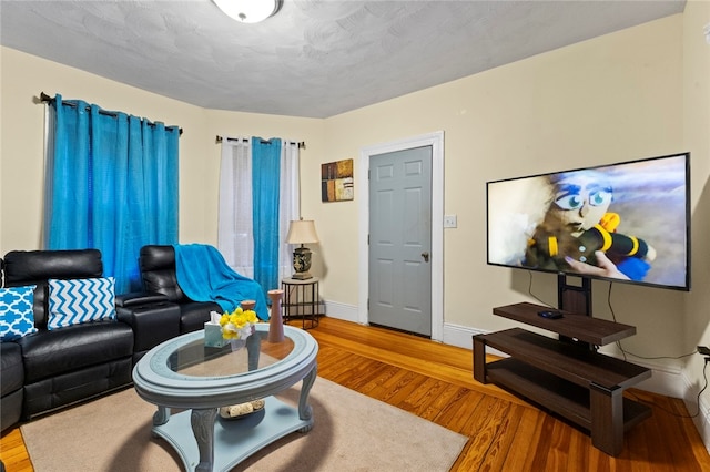 107 Lenox Ave, Providence, RI 02907 - living area featuring baseboards and wood finished floors