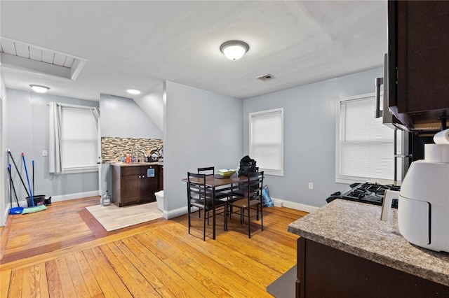 107 Lenox Ave, Providence, RI 02907 - dining space with light wood-style floors, baseboards, and visible vents